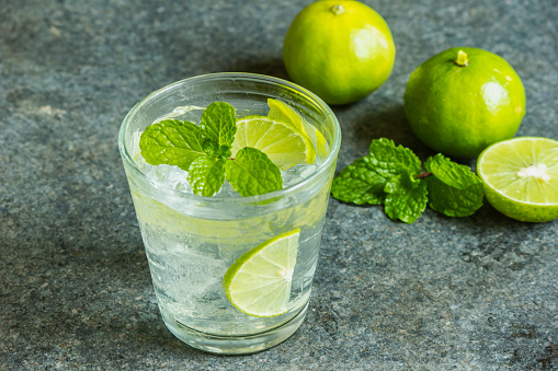 A glass of refreshing mint lemonade and lime juice.