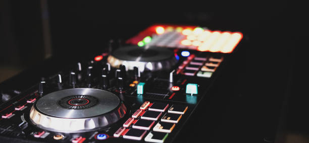 istock DJ controller close up view in live performance night club dance music. 1643816924
