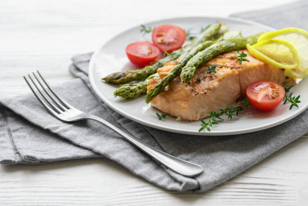 istock Baked Delicious salmon, green asparagus on  plate 1643821983