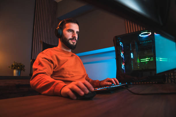 istock Nighttime Male Gamer Focused on Winning 1643822576