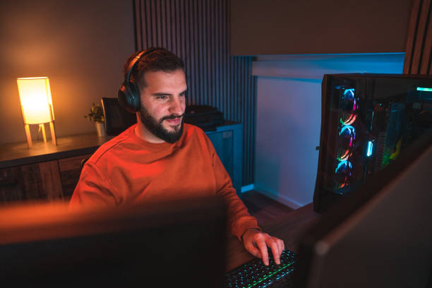 istock Geek Man Having an Intense Gaming Session from Home 1643822579
