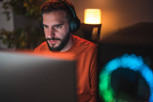 istock Front View of a Man Playing Video Games 1643822587