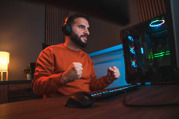 istock Victorious Man Reacting with his Hands when Winning the Game 1643822713