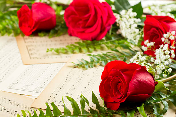 istock Roses And Antique Sheet Music With Copy Space 164382790