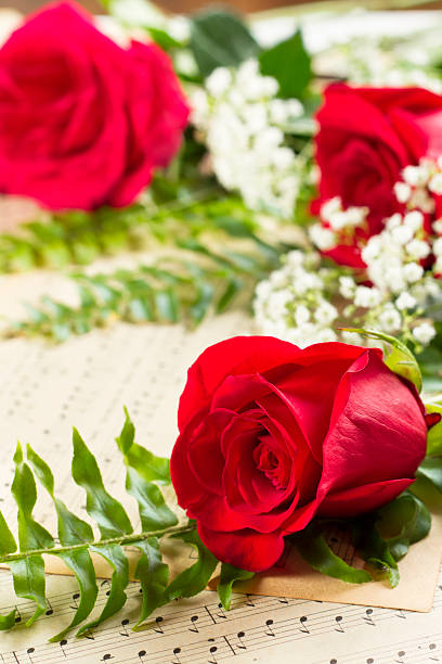 istock Roses And Antique Sheet Music With Copy Space 164382795