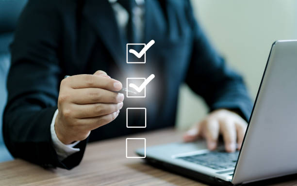 istock Businessman hand writing a check mark in the box confirming the agreement Decision approval concept agree with business decision 1643833366