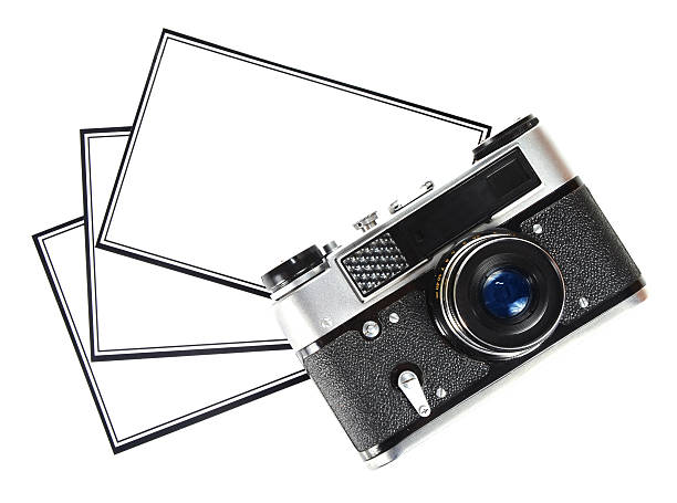 istock old retro camera and blank photo 164383367