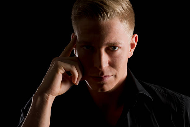 istock Low key portrait of young confident man. 164383457