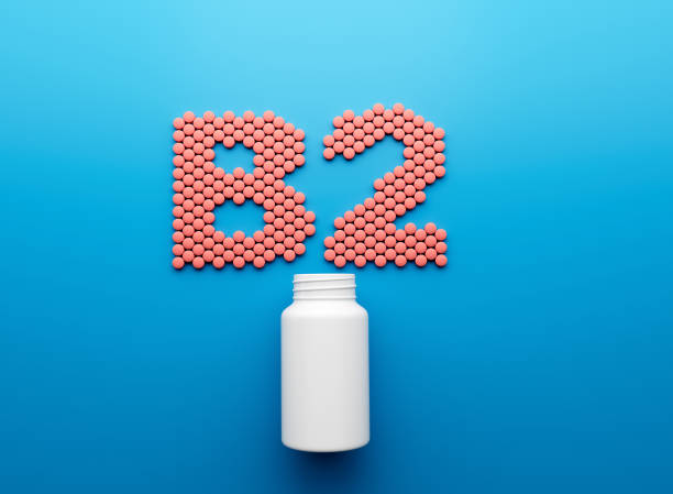 istock 3d Empty White Pill Bottle With B2 Text Made Of Rounded Vitamin B2 Tablets 3d Illustration 1643840635