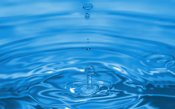 istock A water droplet falling into a tranquil body of water, creating ripples and splashes 1643841210