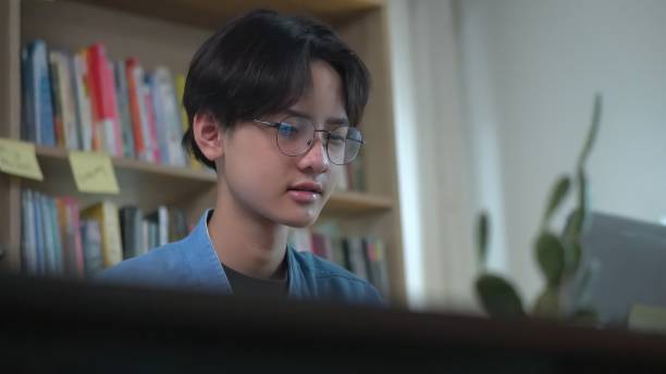 istock Young asian is working on laptop in the home. 1643843444