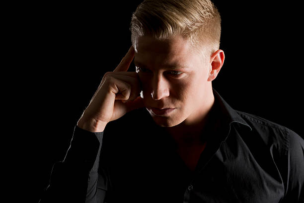 istock Low key portrait of attractive man looking aside. 164384588