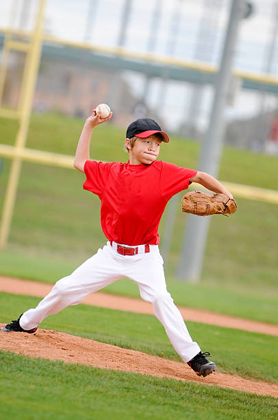 istock Pitcher in red throwing the pitch. 164384960
