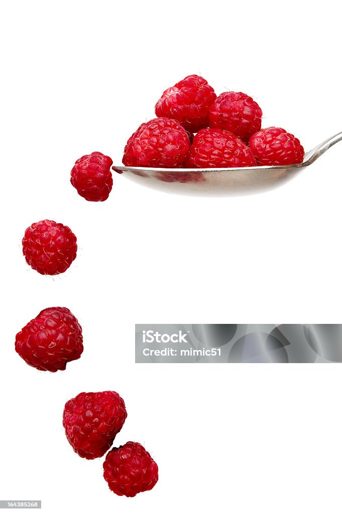 Framboises sur une cuillère isolé sur fond blanc - Photo de Aliment libre de droits