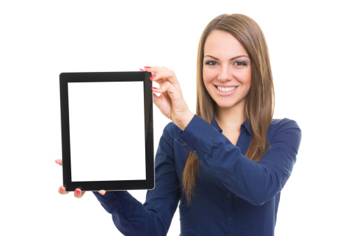 Portrait of a beautiful  young Caucasian woman showing blank digital tablet screen. Isolated on white background. Copy-space available on digital tablet screen.
