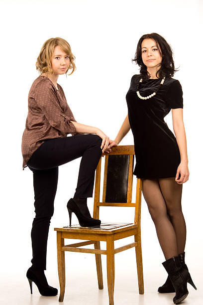 istock Two sexy young women posing together 164385927