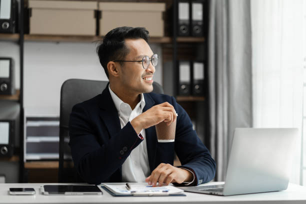 istock Happy male enjoying work at home office. 1643859779