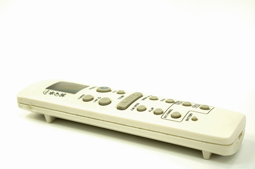 Table top view TV remote control on the white background with copy space
