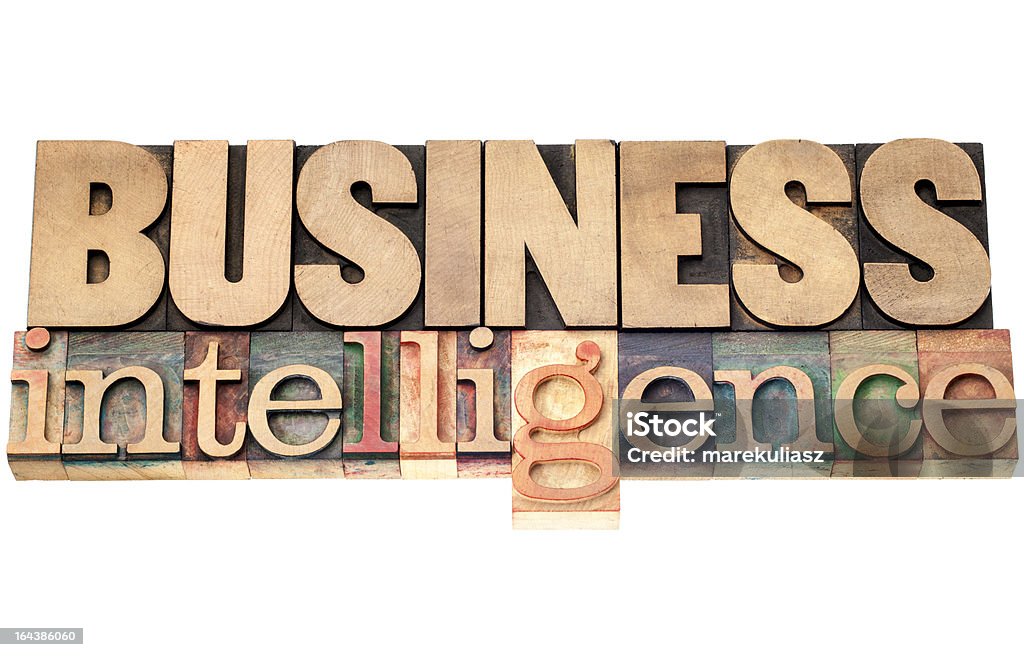 business intelligence in wood type business intelligence - isolated text in vintage letterpress wood type printing blocks Antique Stock Photo