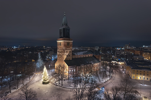 Aerial view of Turku Cathedral in Finland and the tall Christmas tree that decorates its courtyard every year. Turku Cathedral is medieval basilica which originally built out of wood in the late 13th century.