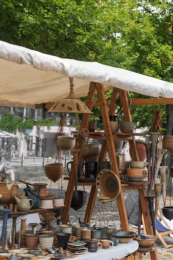 Art ware, tableware, decorative ware in rustic style. Clay crafting, Stoneware, Earthenware, Ceramic art. Tough and practical, utilitarian ware for the kitchen. Fair of pottery on the city square