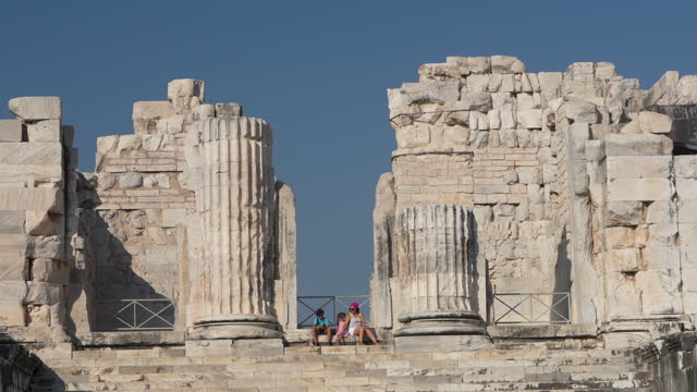 4k video of mother, son and daughter in ancient Greek city ruins
