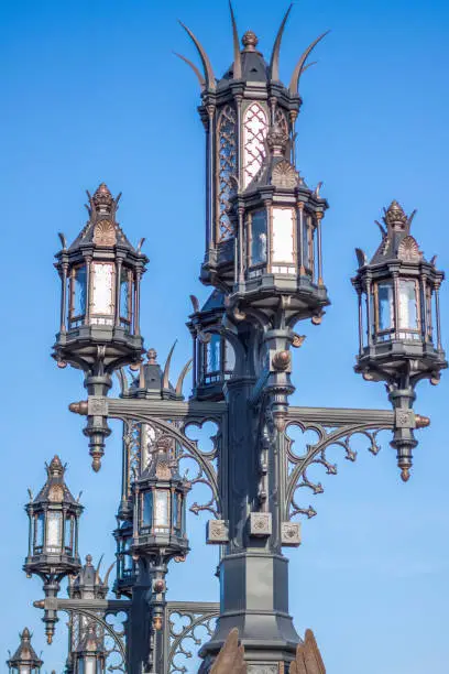 Photo of Street lamp in Gothic style. Ancient city