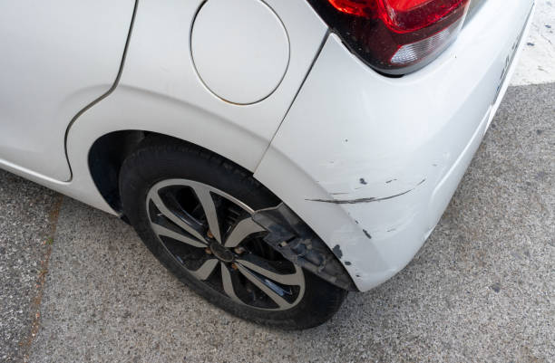 istock Paint scratches on a bumper of the white car 1643926100
