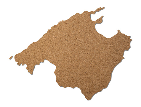 Mallorca island map cork wood texture cut out on white background.