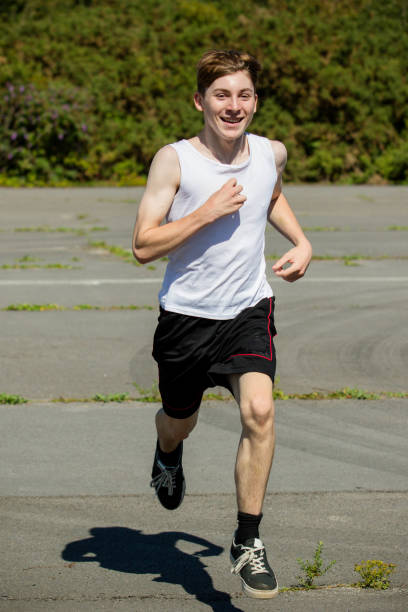 istock Teenage boy running during summer 1643949868