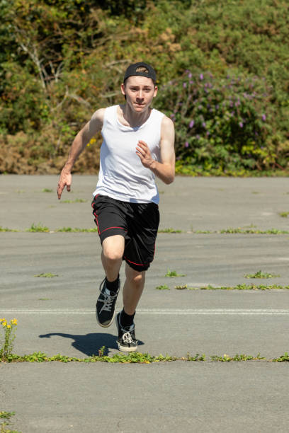 istock Teenage boy running outside 1643958990