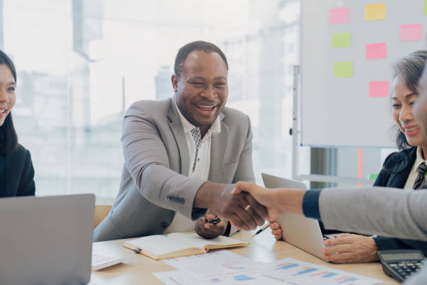 istock Happy mature business man handshaking corporate client, making partnership with partner investor 1643959010