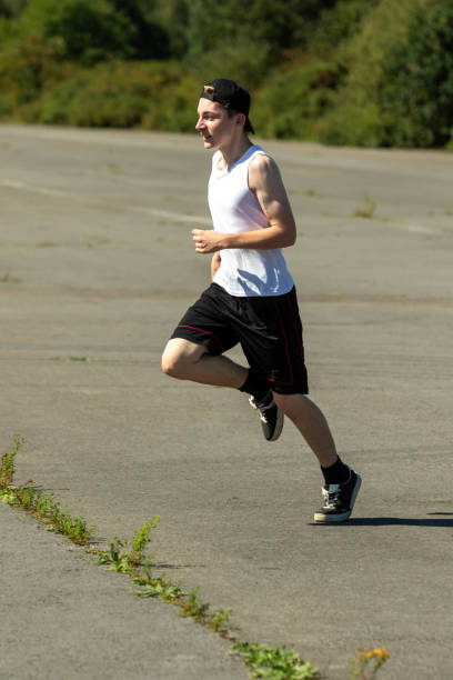 istock Teenage boy running outside 1643962266