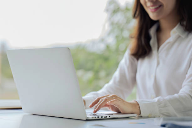 istock Closeup shot of hands using laptop and typing on keyboard, searching information 1643964933