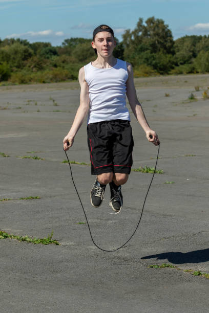 istock Teenage boy skipping with a skipping rope 1643964977