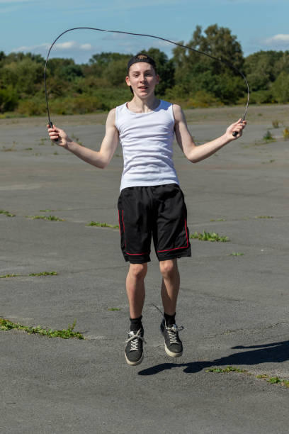 istock Teenage boy skipping with a skipping rope 1643965006