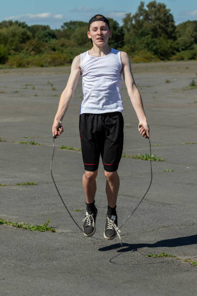 istock Teenage boy skipping with a skipping rope 1643965256