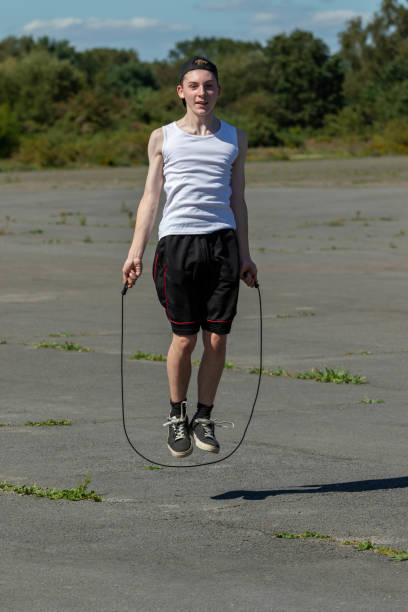 istock Teenage boy skipping with a skipping rope 1643965331