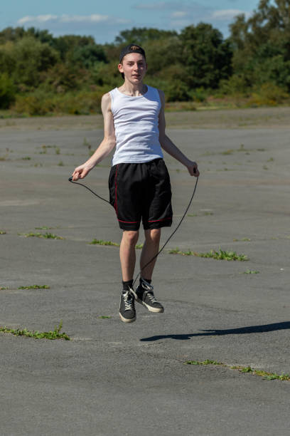 istock Teenage boy skipping with a skipping rope 1643965368
