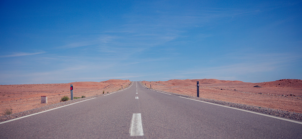 Wind-swept road in the Namib Desert, Namibia near Luderitz, in the Sperrgebiet National Park.
