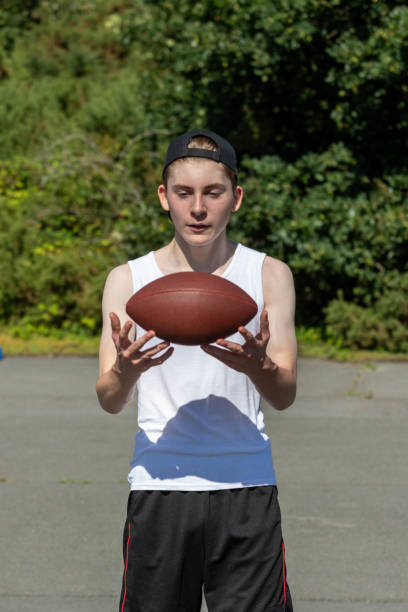 istock Throwing an American Football 1643969477
