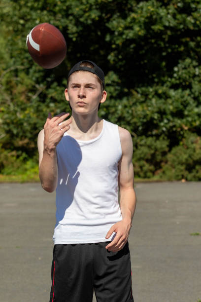 istock Throwing an American Football 1643970581
