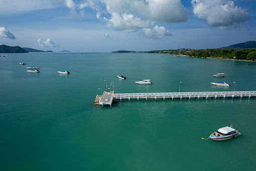 Aerial View Drone shot of Yacht and sailboat parking in marina, Transportation and travel background, Beautiful sea in summer season