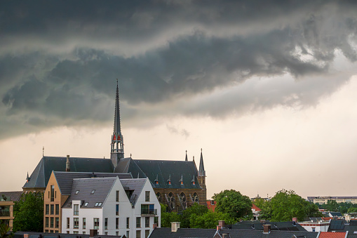 Storm clouds over Zwolle during a summer thunderstrom at the end of a warm and humid summer afternoon. A shelf cloud is approaching over the rooftops and the Dominicanenklooster.