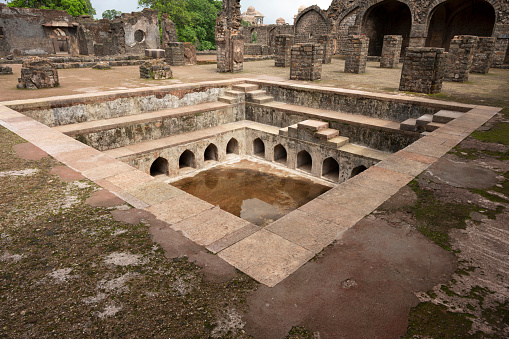 Hammam, bath or swimming pool and ruins near Hindola Mahal, situated in the fort, built by Sultan Ghiyasuddin Khilji, Mandu, Madhya Pradesh, India