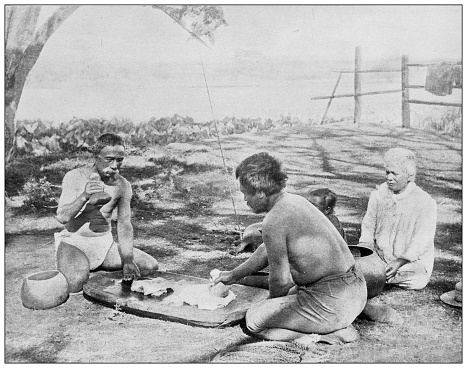 Hawaii, antique photo: Converting taro paste (paiai) to poi