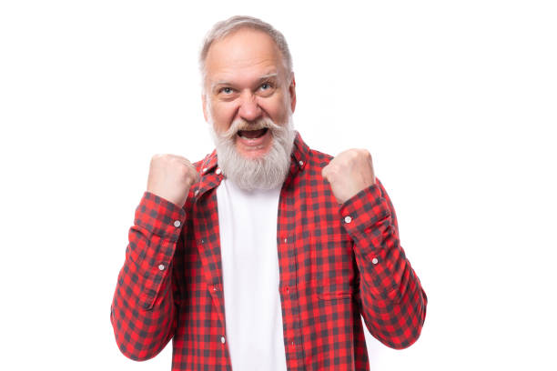 istock joyful successful 60 year old gray-haired pensioner man with a beard and mustache 1644005157