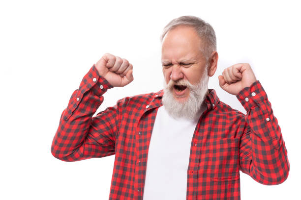 istock joyful lucky 60s retired man with white beard and mustache in red shirt 1644005288
