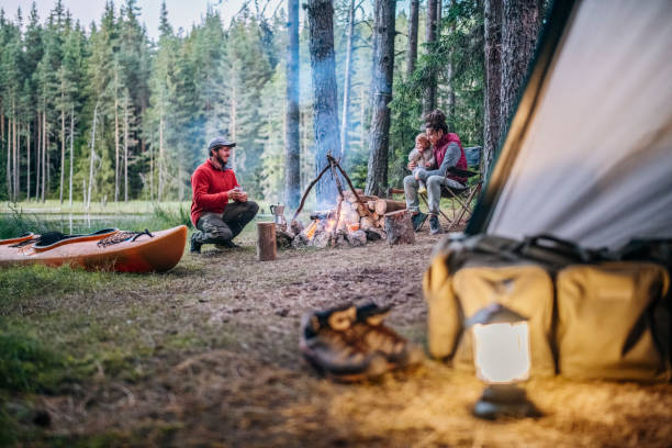 istock Happy family having a peaceful moment around the campfire. 1644005336