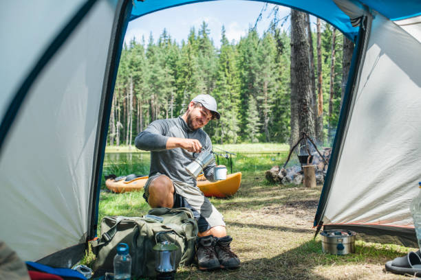 istock Man on camping having freshly brewed coffee in the morning. 1644005383